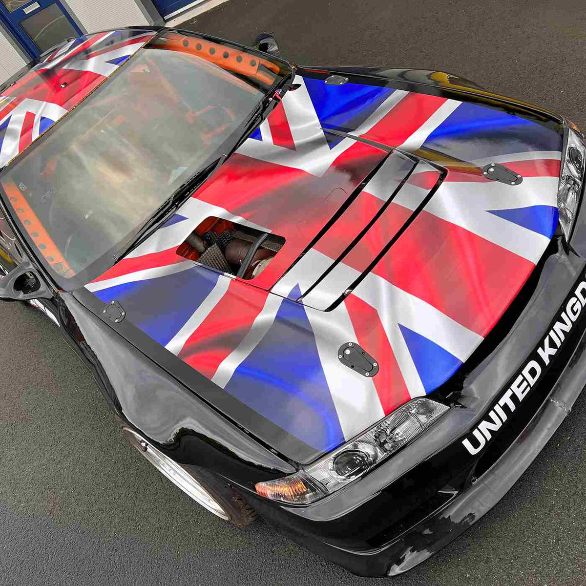 Red, white and blue flag graphics on a car, from the MetaGuard MGC manufacturer gallery.