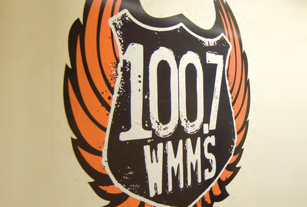 Printed 100.7 WMMS wall decal; representative Wallnoodle application, not the unprinted matte white roll or proof of roll width.