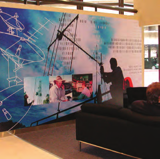 Representative MACtac PP5000 family application showing mounted wall graphics; finished display and furniture are not included.