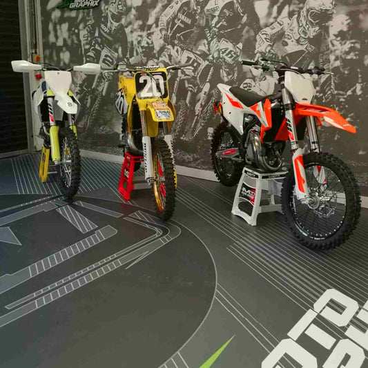 Graphic floor beneath display motorcycles, from the MetaGuard FloorArt gallery.