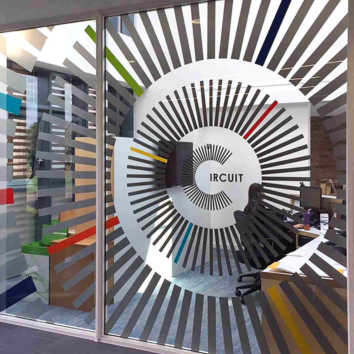 Radial graphics on an office glass partition, from the Metamark MD-CRR gallery.