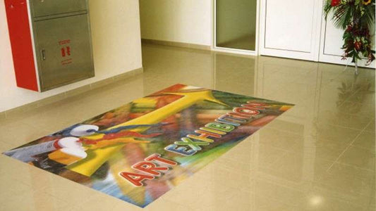Colorful ART EXHIBITION graphic on an indoor tiled floor; representative PF6454 application, not a photograph of the supplied roll.