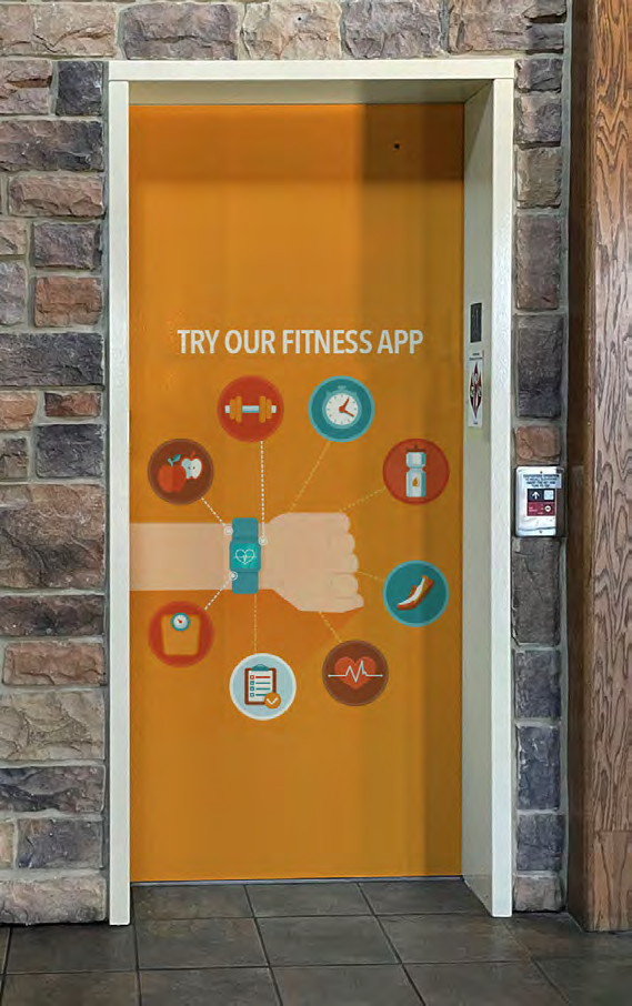 Orange fitness-app graphic covering elevator doors; OODLE family example, exact film unidentified, not the supplied unprinted Permanoodle roll.