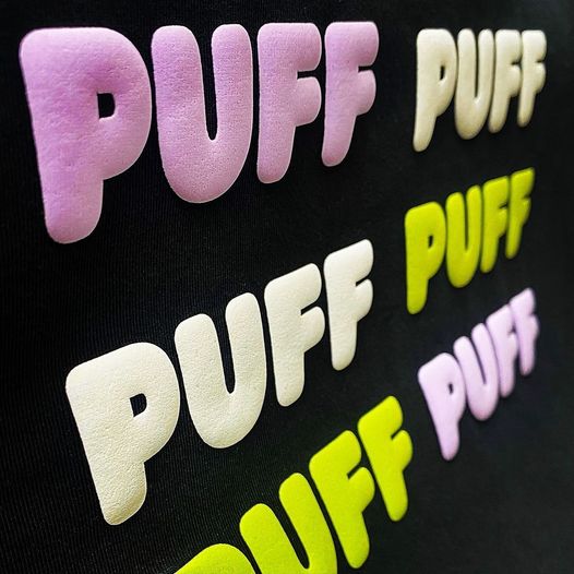 Representative puff lettering in pink, white and yellow-green on black fabric; finished application shown, not the supplied sheet or every color.